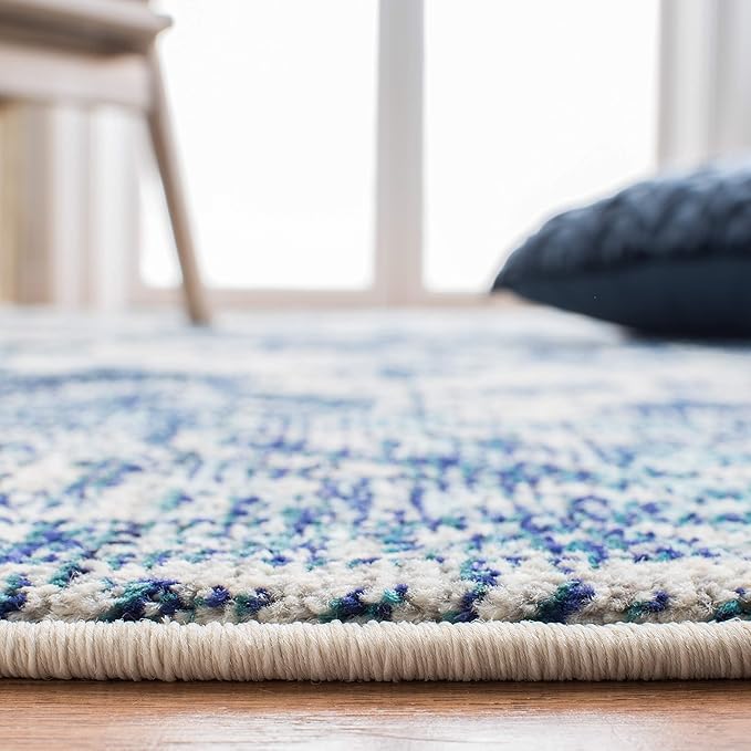 SAFAVIEH Monaco Collection Area Rug - 5'1" x 7'7", Ivory & Blue, Boho Chic Medallion Distressed Design, Non-Shedding & Easy Care, Ideal for High Traffic Areas in Living Room, Bedroom (MNC243A)